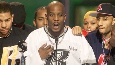 Rapper DMX (C) offers a prayer after winning the R&B Albums Artist of the Year award at the Billboard Music Awards show at the MGM Grand Hotel in Las Vegas December 8